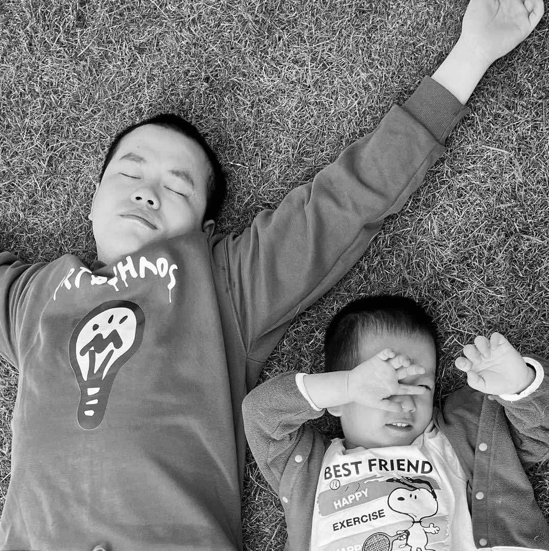 Fig 2: Me and my first son Bull lying on grass